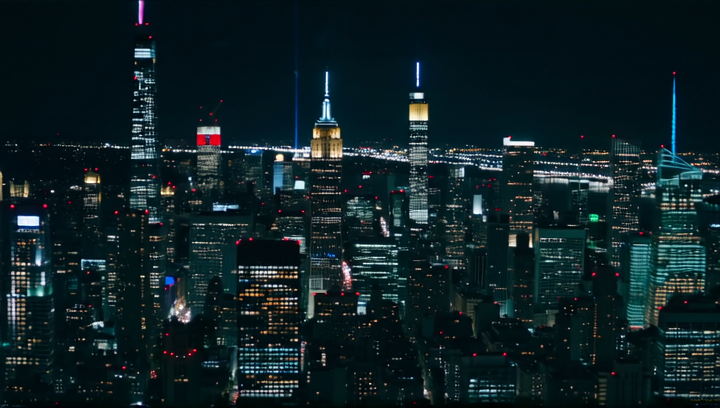 The camera pans over a city skyline at night, the sound of a blues song filli...